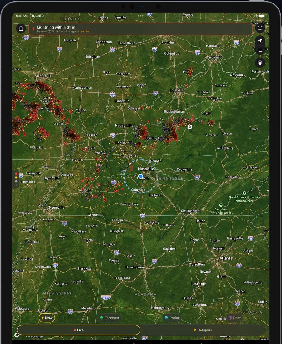 Lightning Tracker running on iPad, showing the live strike map with color-coded lightning strikes around an alert radius ring